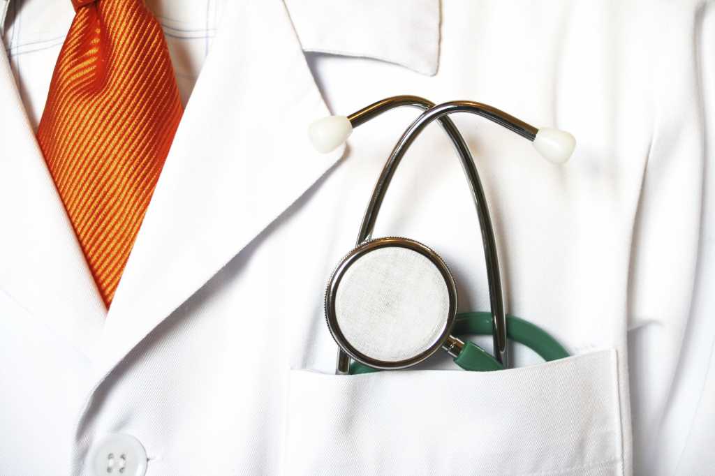 Doctor prepared to examine the patient 105770502