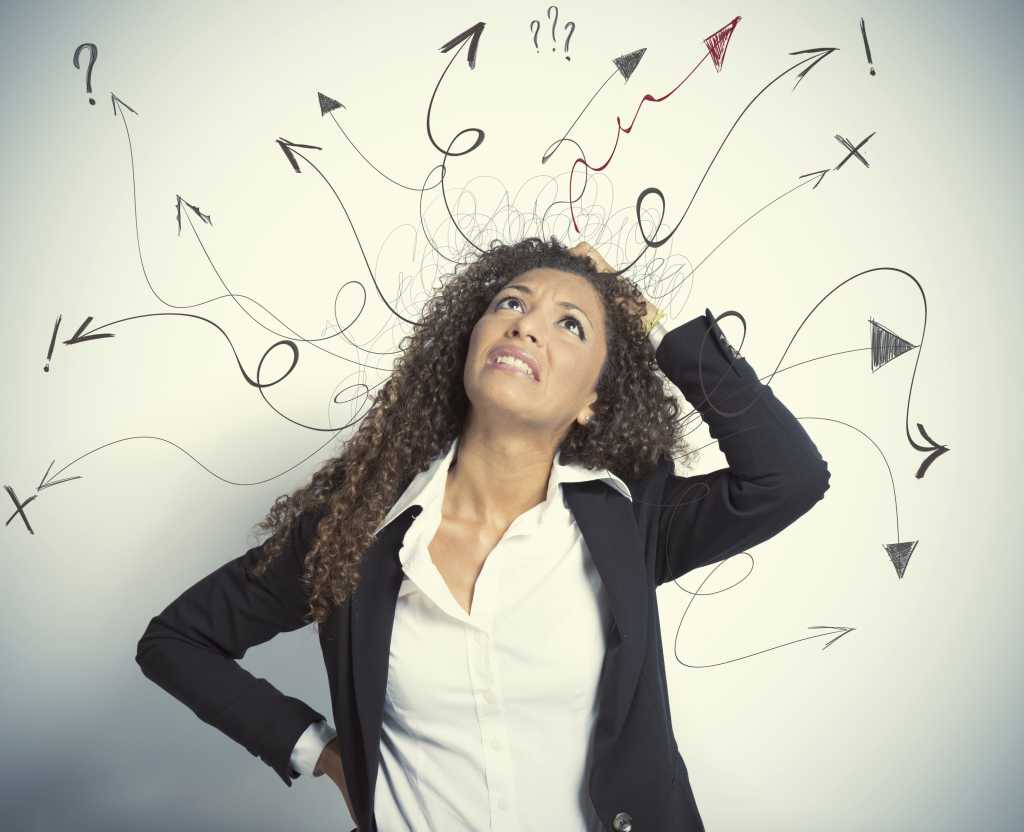 Woman scratching her head with arrows and question marks around her