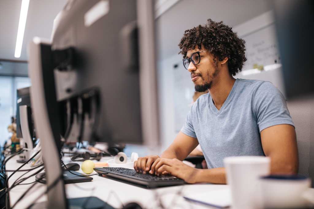 Man working at desk on computer