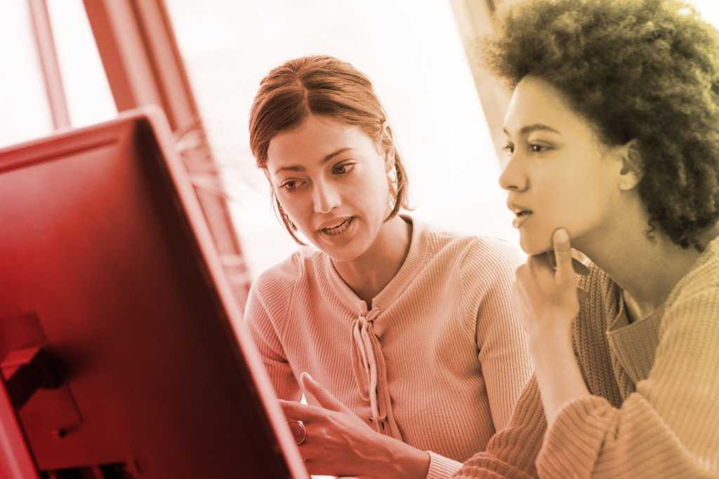 apprentice mentor job training internship women collaborating at computer by gilaxia getty images