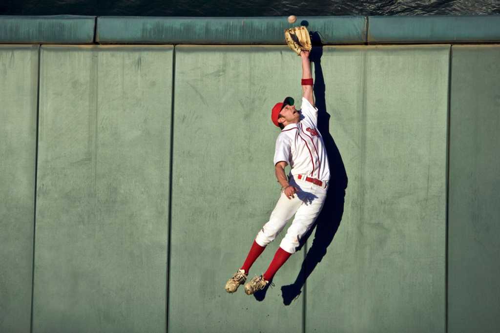 baseball player agile jumping and flying