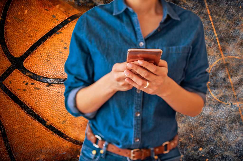 basketball grunge woman with smartphone mobile tickets pro basketball court by natasaadzic getty