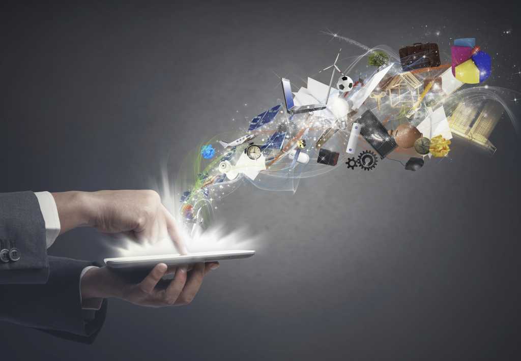hand holding tablet with apps flying above