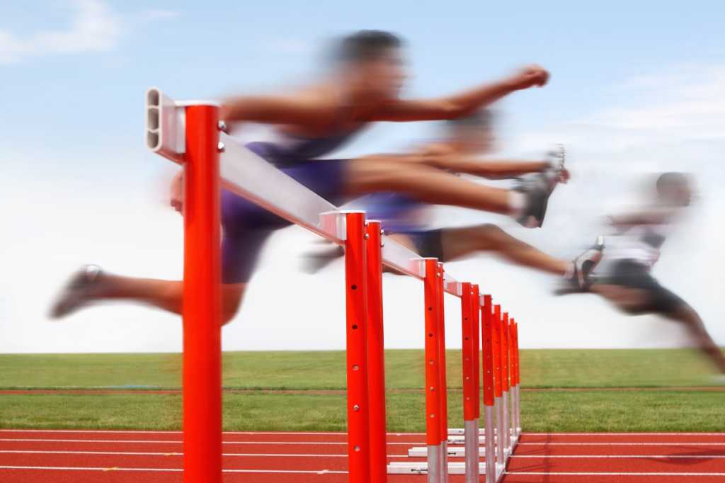 bigstock hurdle race men jumping over 113111615