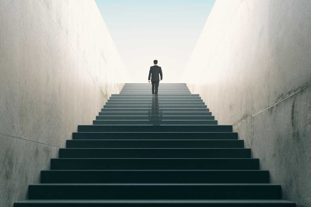 businessman climbing stairs / growth / achievement / new territory