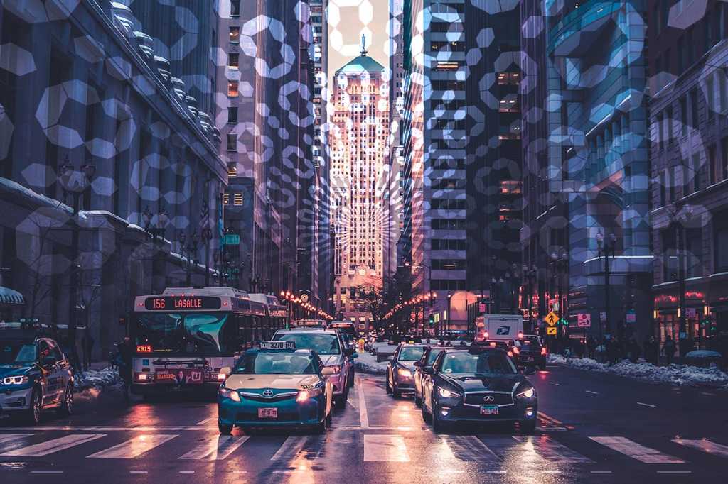 traffic on a city street at sunset surrounded by binary code / smart cars / smart city