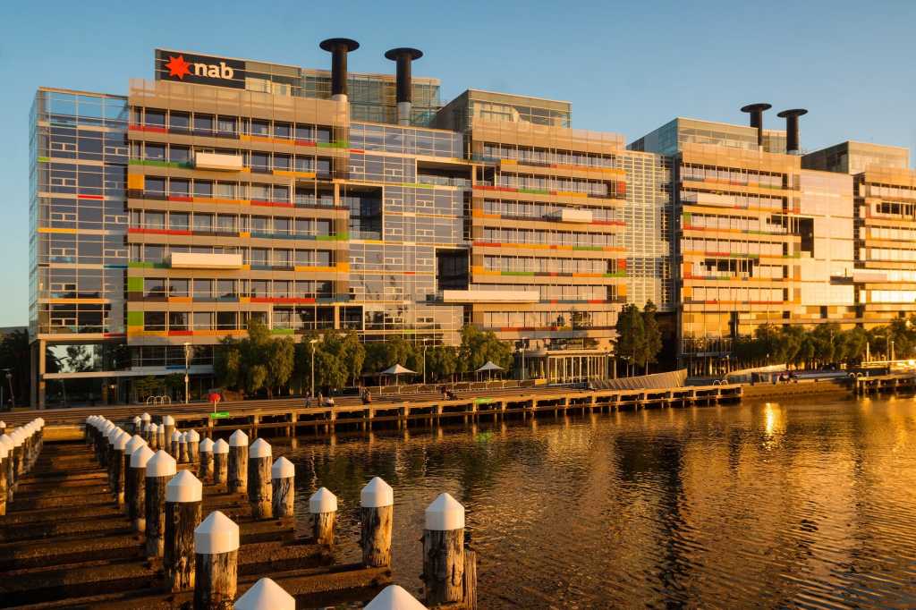 NAB in Docklands [Building on water with the NAB adorning the top of the building]