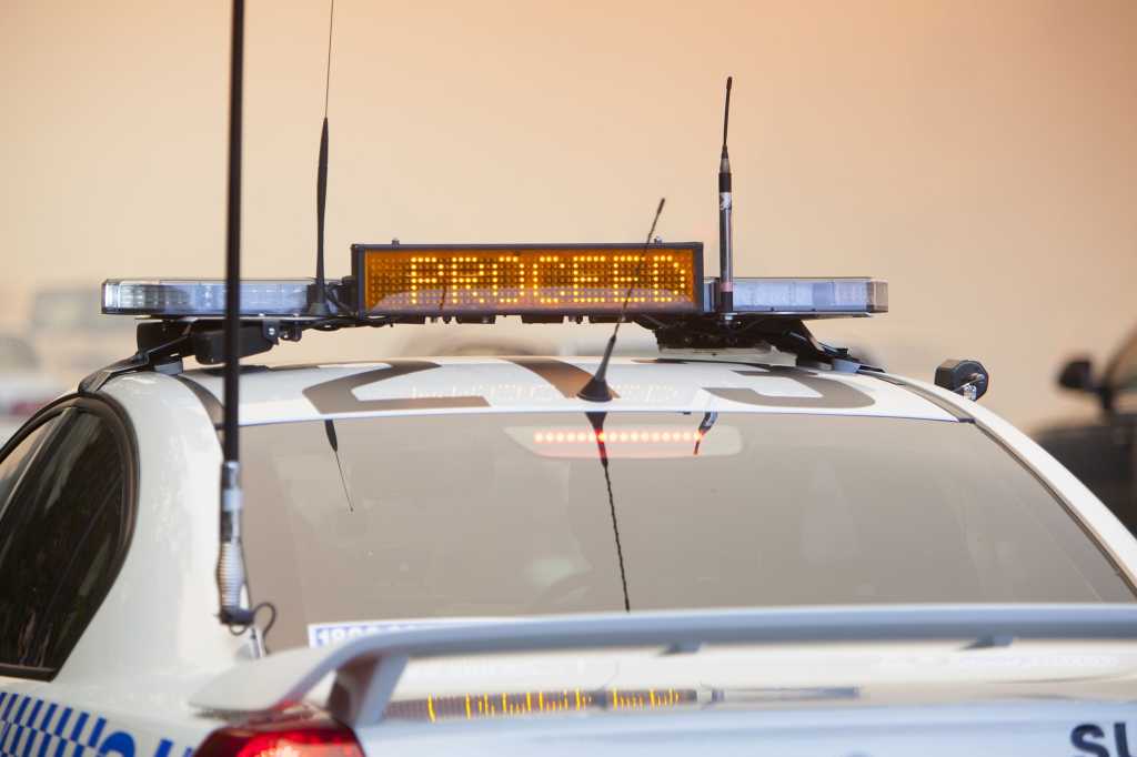 A police car displays 'PROCEED' on an LED message board [law enforcement/authority/Australia]