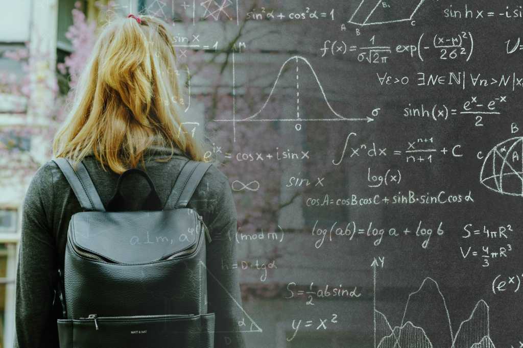 college school girl with backpack graduate chalkboard student by tim gouw via unsplash