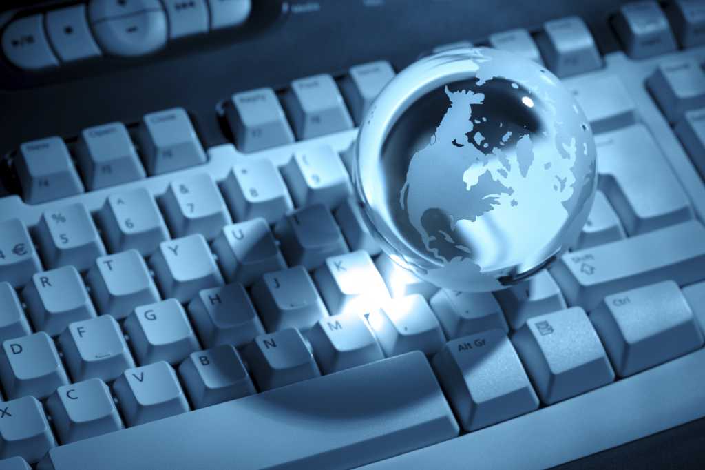 crystal globe displaying the united states of america on a keyboard