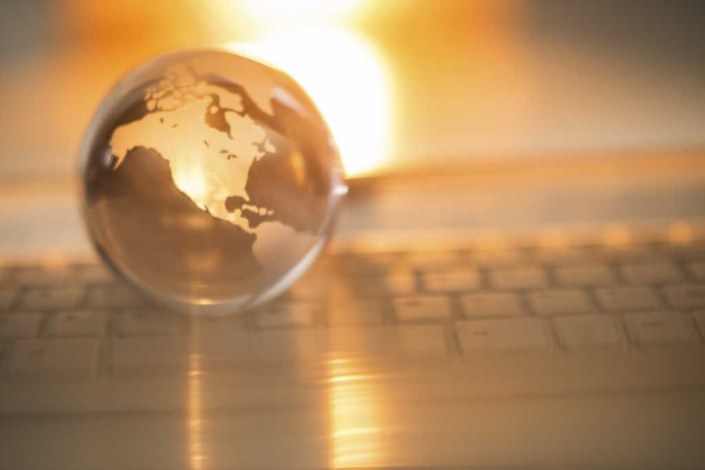 crystal globe displaying the united states of america on a keyboard