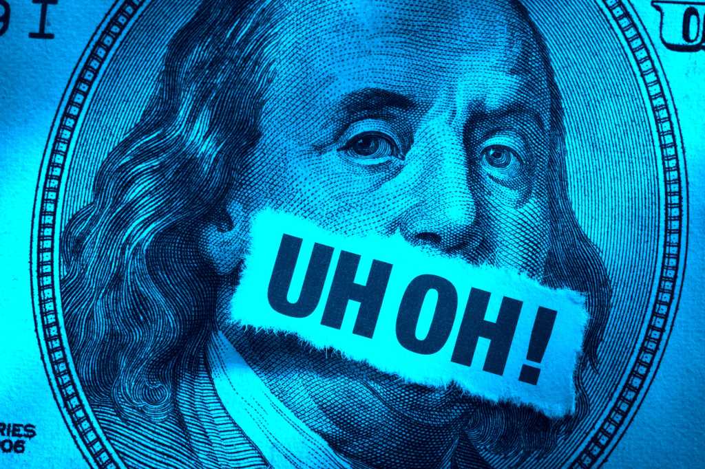 CSO > Money trouble > A one hundred-dollar bill with 'UH OH!' across Benjamin Franklin's mouth.