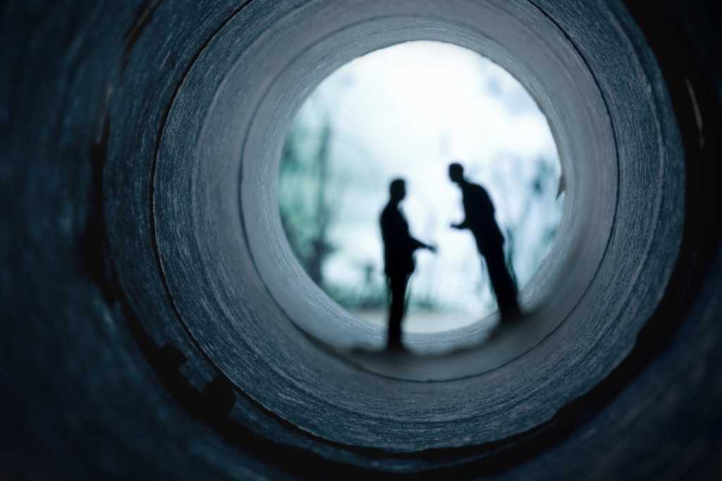 dark secrets of enterprise architecture men meetng in dark tunnel