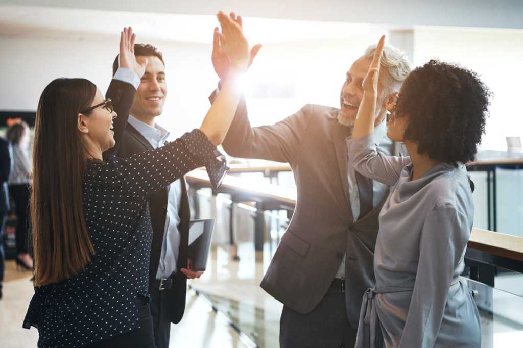 diverse team high five applause congratulations success celebrate