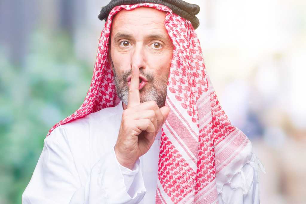 diversity saudi arabia saudi man gesturing to be quiet secret uae middle east by aaronamat gettyima