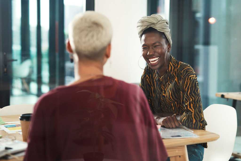 diversity south africa confident smiling south african woman in office at desk by peopleimages gett
