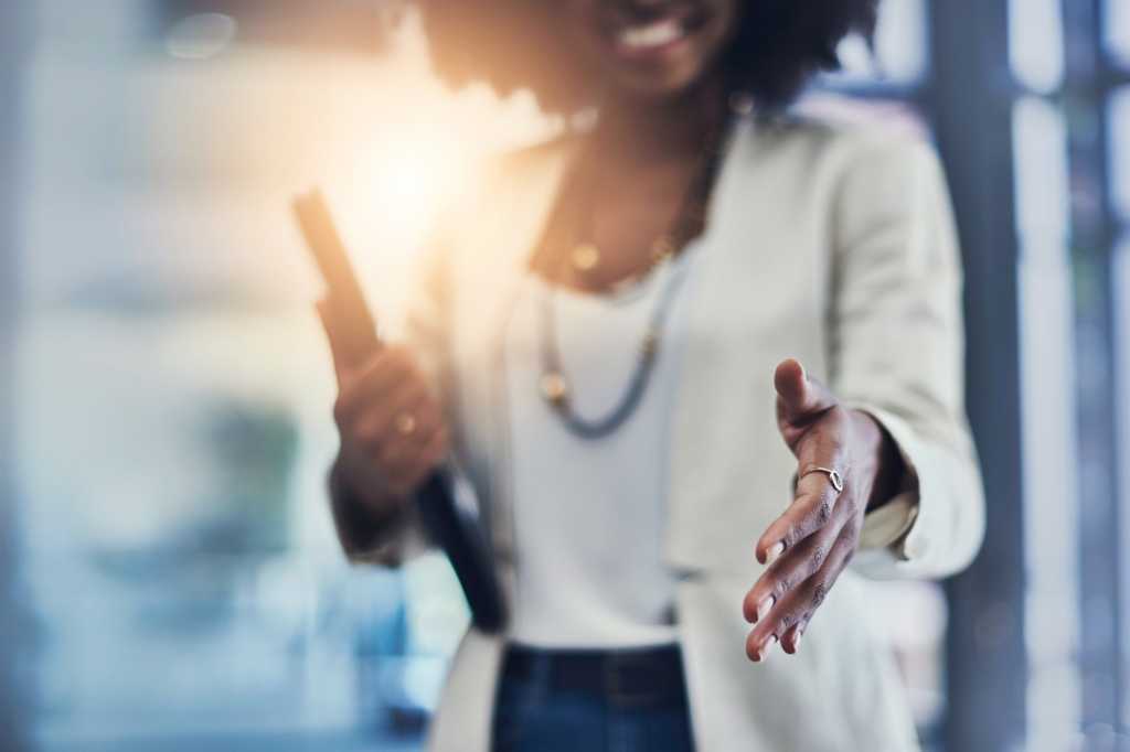 diversity south african woman reaching out to shake hands make deal south africa merger and acquisi