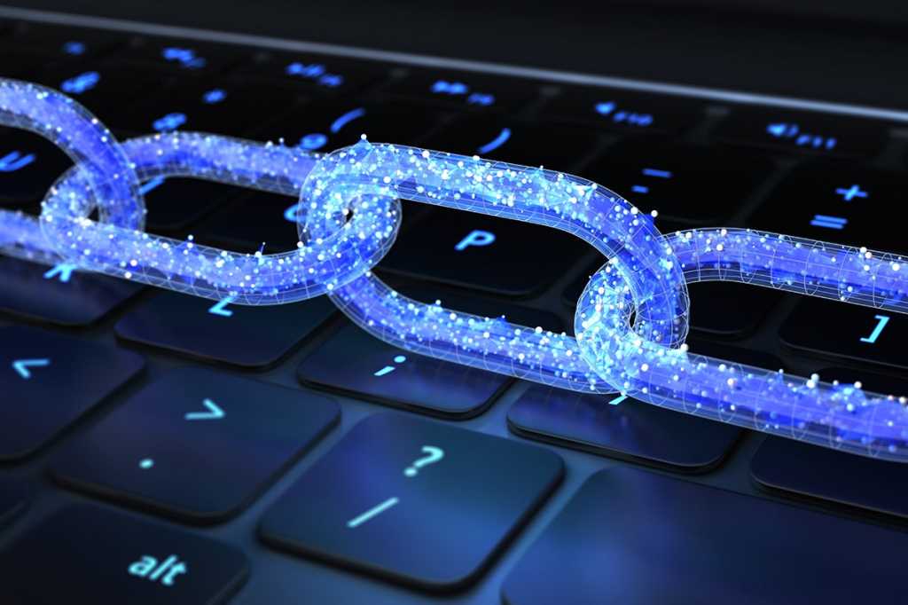 blockchain digital chain of transactions and connections against a keyboard