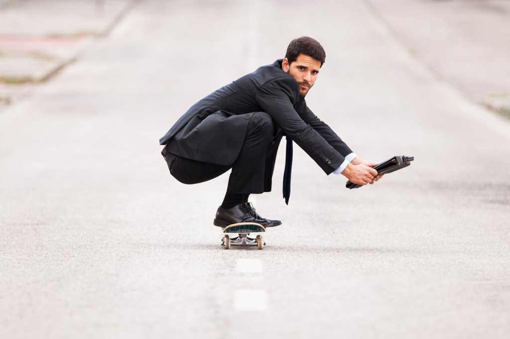 flexible skateboarder agile businessman