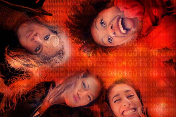 group of diverse young women with tech background