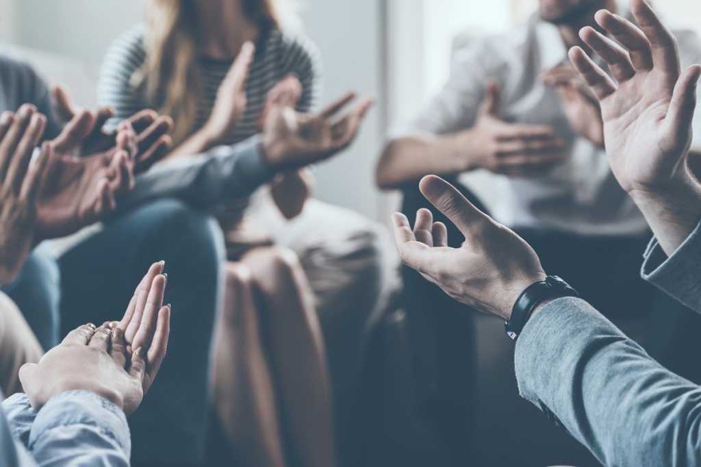 group of people applauding agreement community