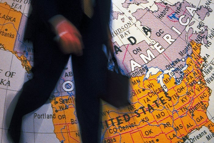 H-1B visa man entering U.S. with briefcase