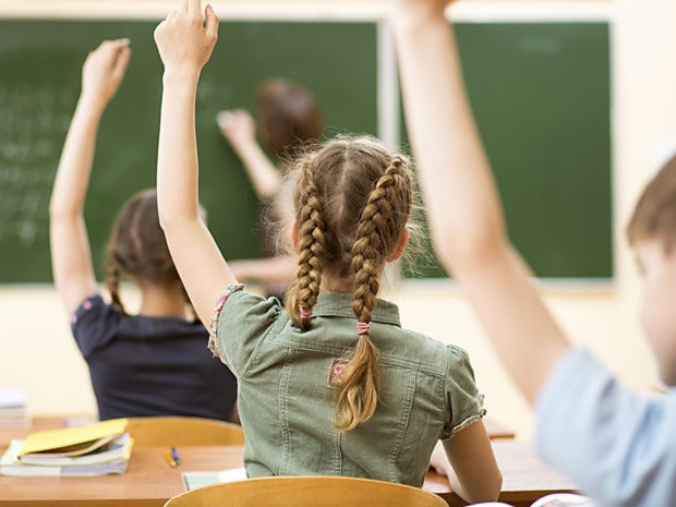 hands raised classroom kids