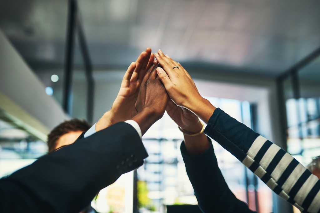 high five / all hands in / teamwork / collaboration / success