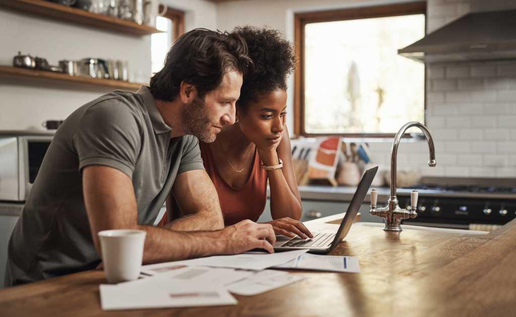 couple viewing laptop