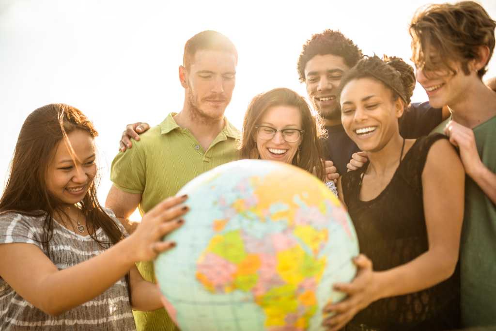 Group reviewing globe