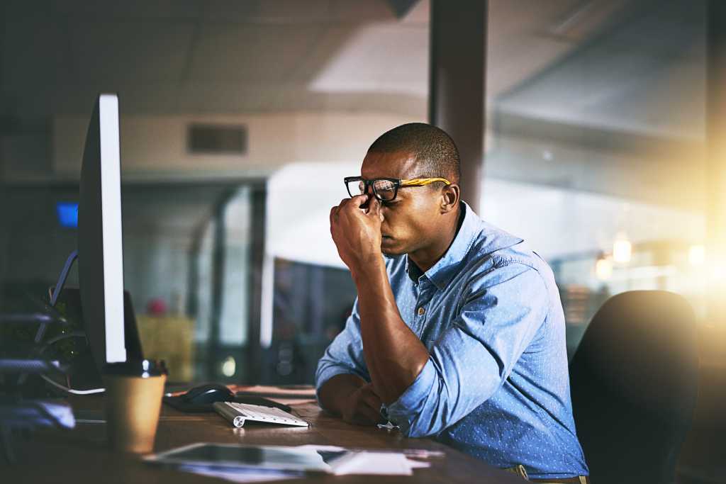 Man frustrated in front of Computer