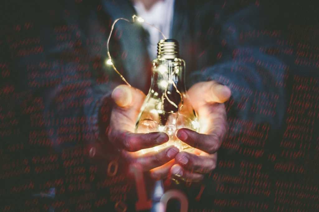 innovation startup hands holding lightbulb spark innovate light by riccardo Annandale via unsplash