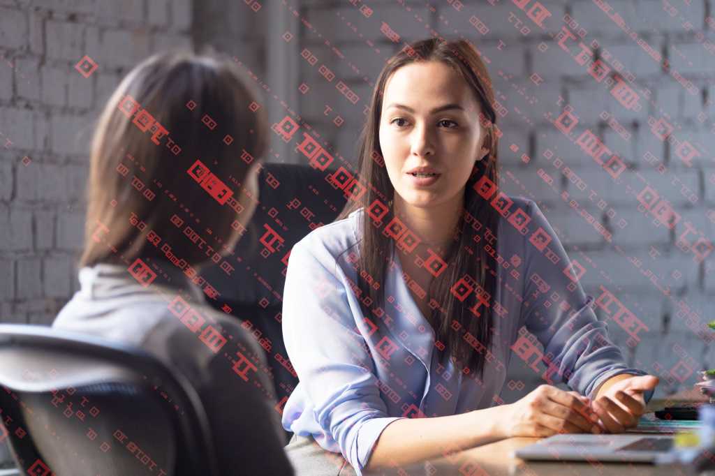 intern mentor millennial internship interview women at desk with computer by fizkes getty images