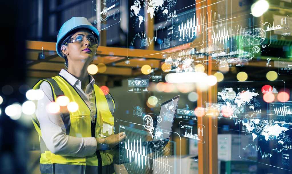 Woman with hard hat in industrial setting