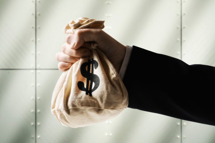 business man holding money bag