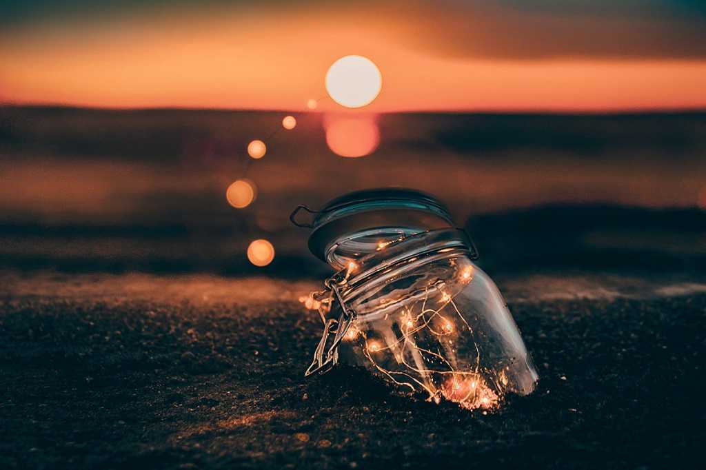 light string in a jar at sunset / lightbulbs / ideas / innovation / brainstorming