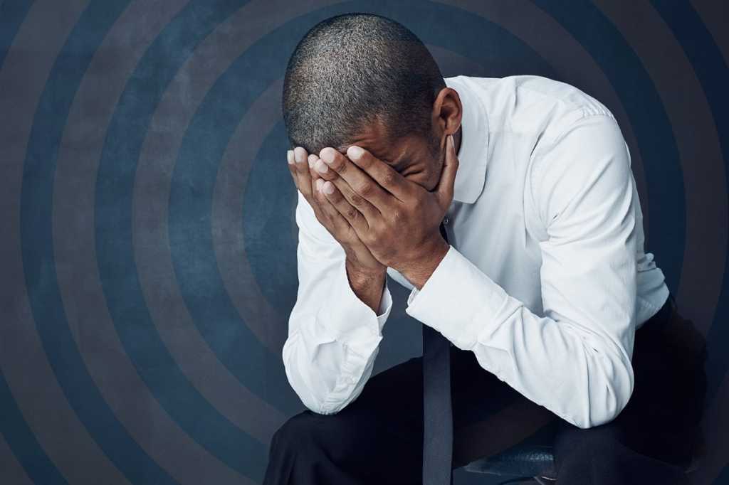 man with face in hands failure mistake by tinpixels getty