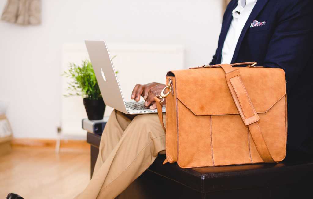 man laptop briefcase working job hunting diversity [by Olu Eletu - CC0 via Unsplash]