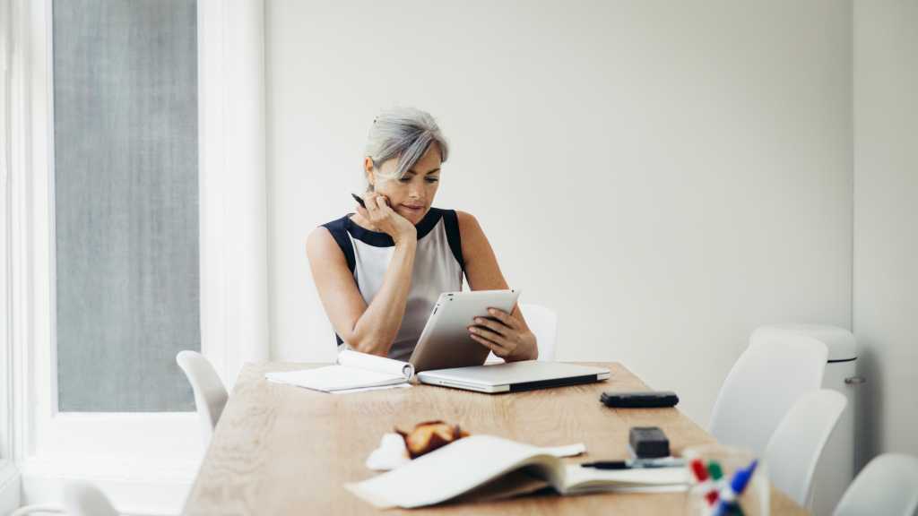 mature female executive evaluating talent