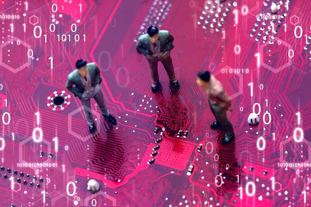 miniature figurines on a circuit board amid binary code / hardware / development / microservices