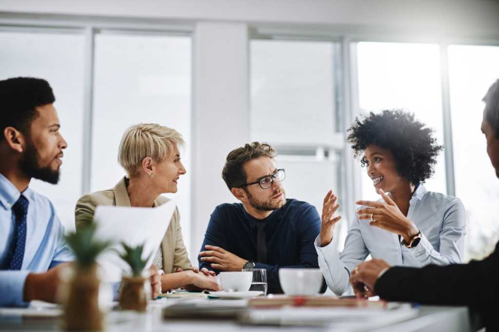Co-workers sitting at a round table