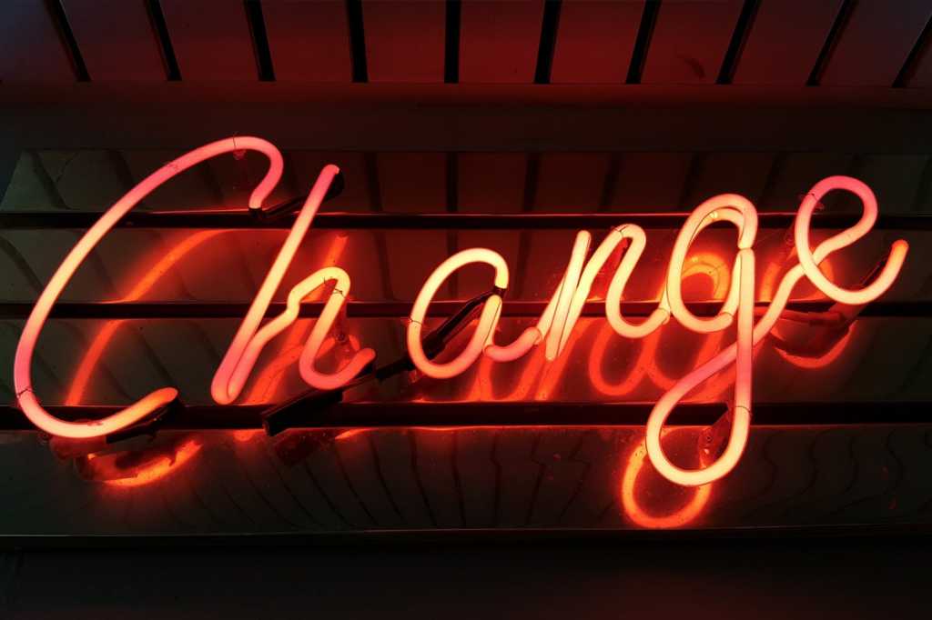 neon sign change management agent career promotion shift start begin by ross findon via unsplash