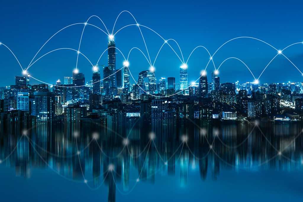 network communication connections along a city skyline at night