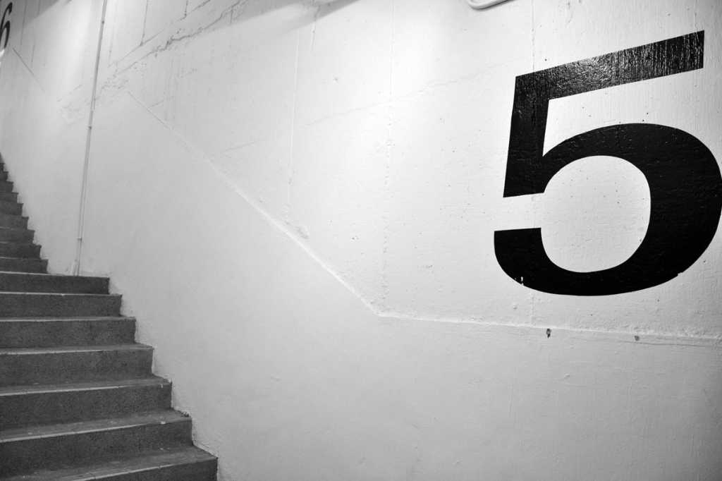 number 5 on parking garage wall top five