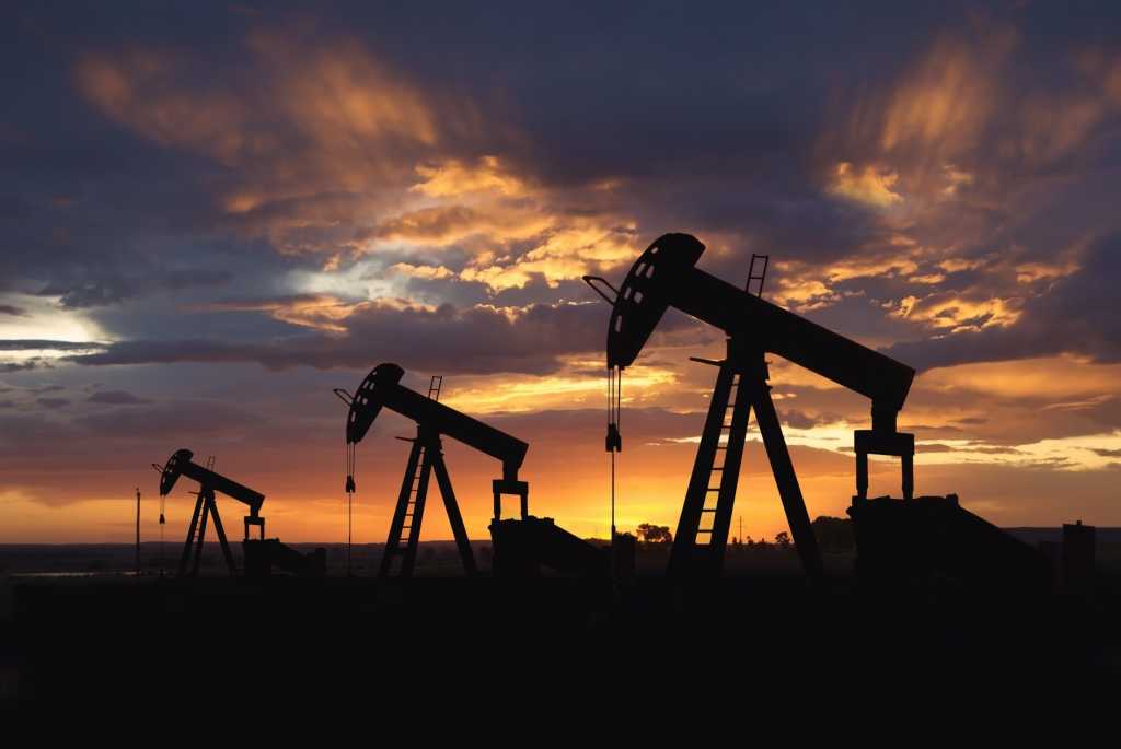 oil wells at sunrise 100838104