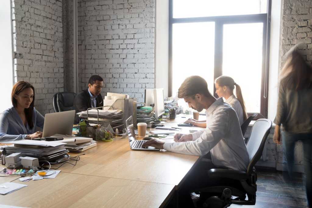 open office space shared office collaboration team open environment by fizkes getty