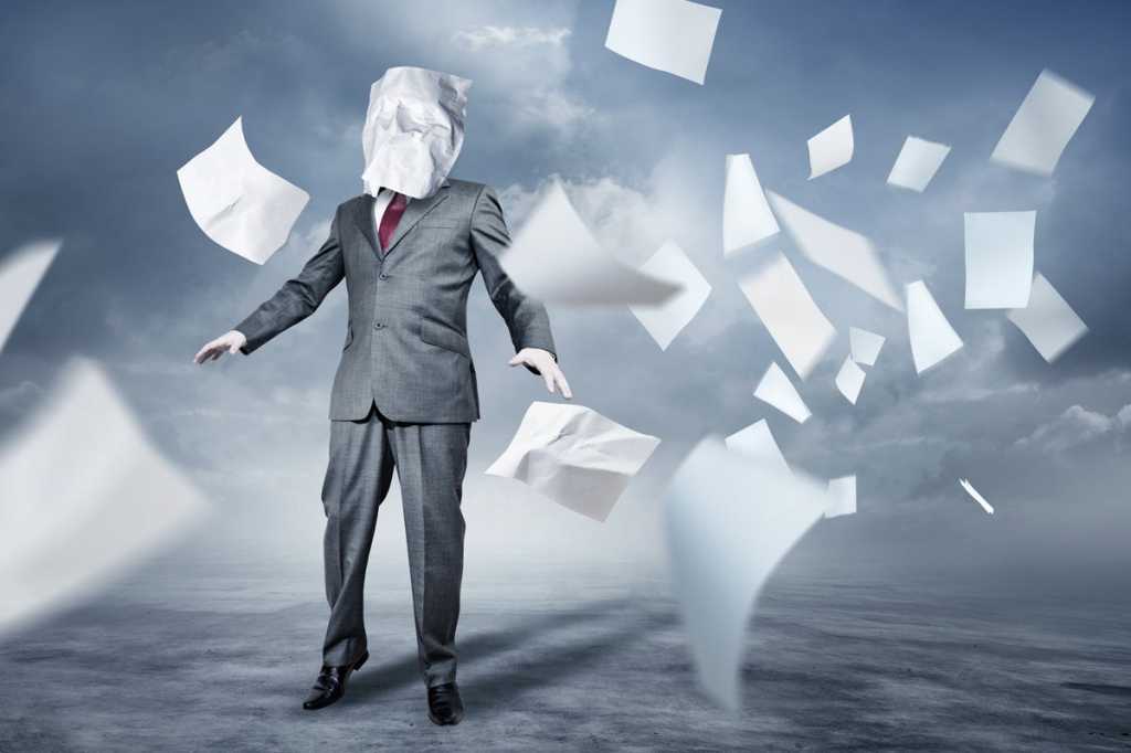 overwhelmed businessman flying papers information overload tornado