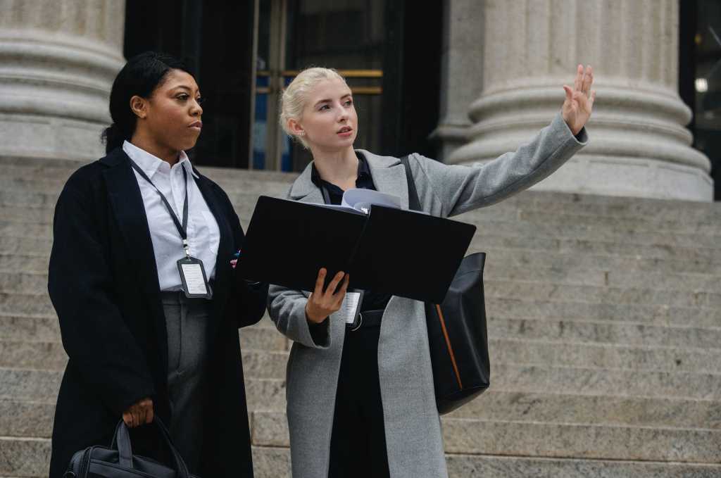 Two Women talking on steps