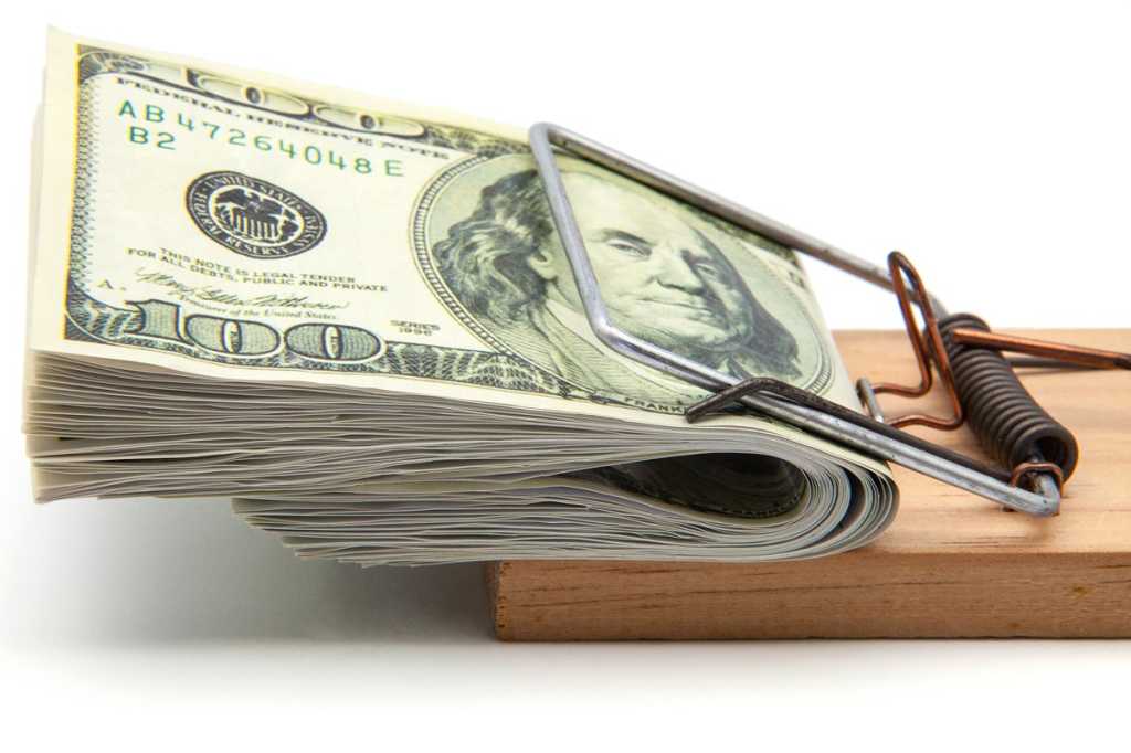 pile of money on mouse trap risk temptation salary