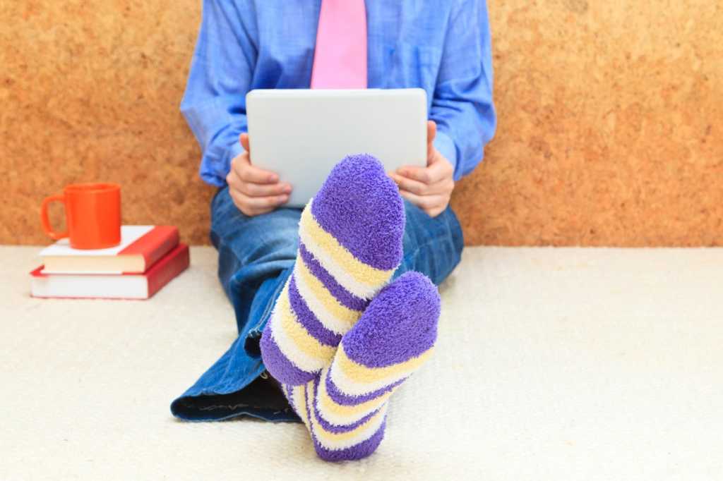 remote worker student working from home striped socks laptop